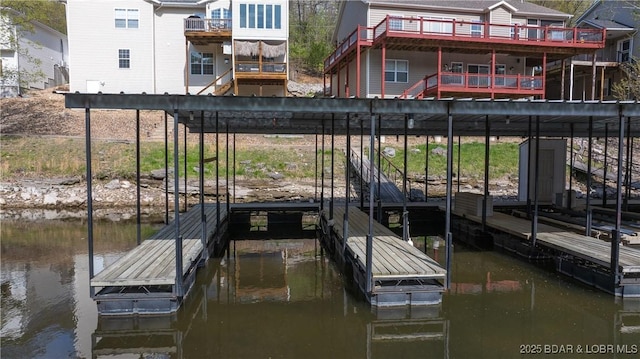 view of dock featuring a water view and boat lift