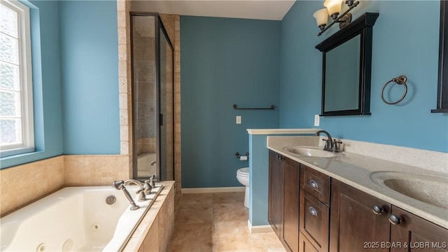 full bathroom featuring a sink, plenty of natural light, a stall shower, and toilet
