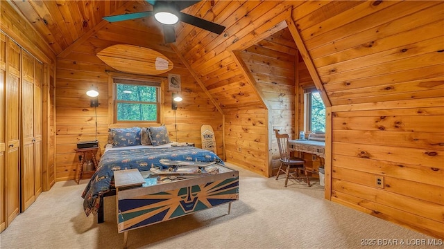 bedroom with wooden walls, light colored carpet, wooden ceiling, and lofted ceiling