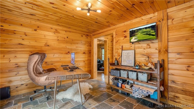 office featuring wood ceiling, wood walls, and stone tile floors
