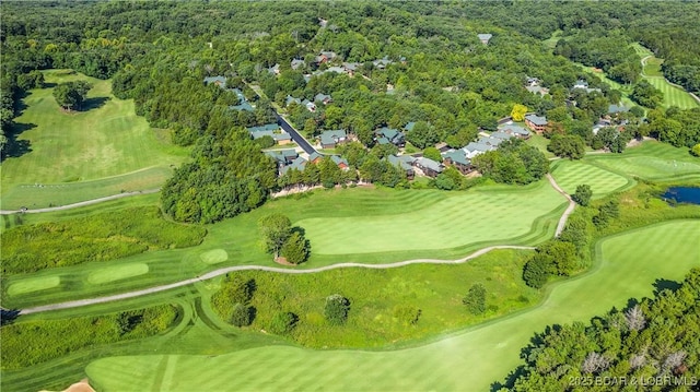 bird's eye view featuring a forest view and golf course view