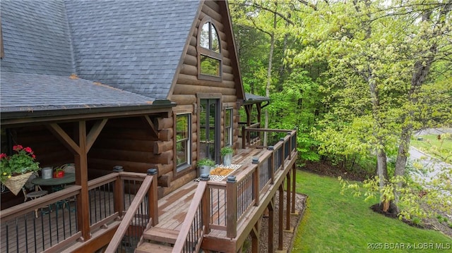 wooden deck featuring a wooded view