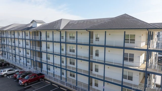 183 Upper Monarch Cove Ct Unit 4E, Lake Ozark, MO 65049 - view of building exterior featuring uncovered parking