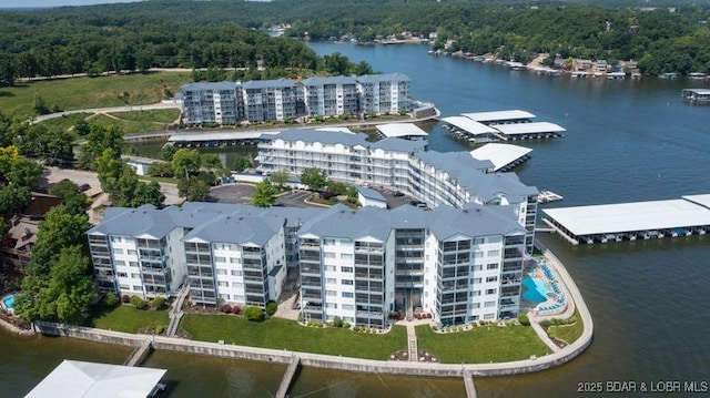 183 Upper Monarch Cove Ct Unit 4E, Lake Ozark, MO 65049 - birds eye view of property with a water view and a wooded view