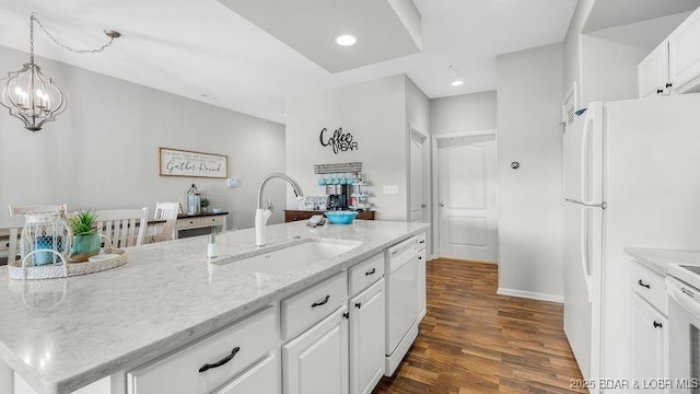 183 Upper Monarch Cove Ct Unit 4E, Lake Ozark, MO 65049 - kitchen with a sink, white cabinets, dark wood-style floors, a chandelier, and white appliances