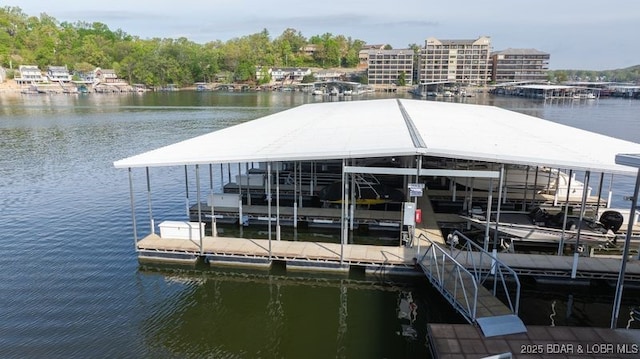 183 Upper Monarch Cove Ct Unit 4E, Lake Ozark, MO 65049 - dock area featuring a water view and boat lift