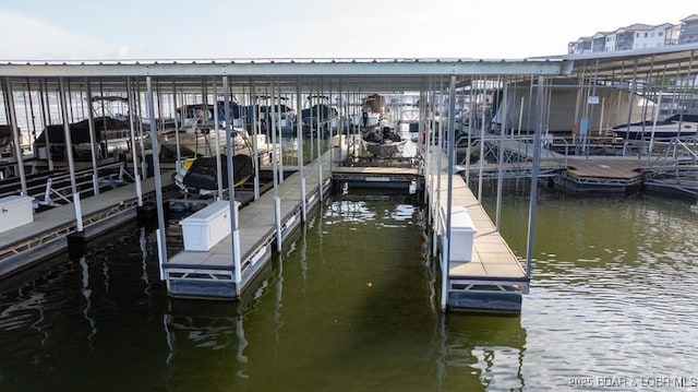 183 Upper Monarch Cove Ct Unit 4E, Lake Ozark, MO 65049 - view of dock with boat lift and a water view