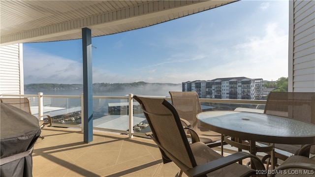183 Upper Monarch Cove Ct Unit 4E, Lake Ozark, MO 65049 - balcony featuring a water view