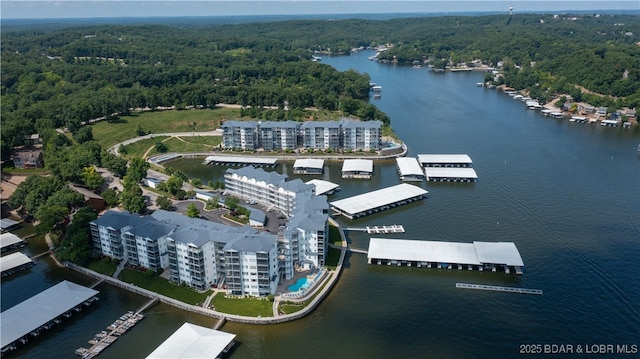 183 Upper Monarch Cove Ct Unit 4E, Lake Ozark, MO 65049 - bird's eye view featuring a water view and a wooded view