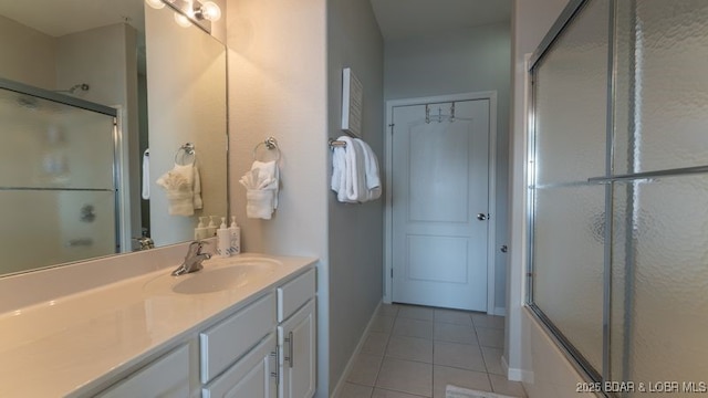 183 Upper Monarch Cove Ct Unit 4E, Lake Ozark, MO 65049 - full bathroom with baseboards, enclosed tub / shower combo, tile patterned floors, and vanity