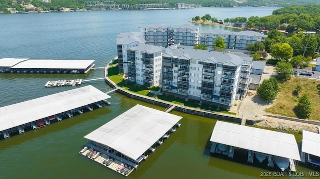 183 Upper Monarch Cove Ct Unit 4E, Lake Ozark, MO 65049 - drone / aerial view with a water view