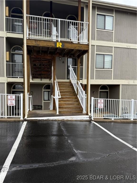611 Lazy Days Rd Unit R-5, Osage Beach, MO 65065 - view of building exterior featuring uncovered parking and stairway
