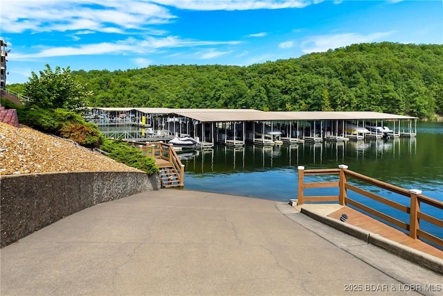 611 Lazy Days Rd Unit R-5, Osage Beach, MO 65065 - view of dock featuring boat lift, a water view, and a forest view