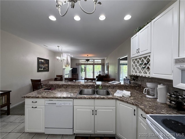 611 Lazy Days Rd Unit R-5, Osage Beach, MO 65065 - kitchen with a sink, white cabinetry, a peninsula, and white appliances
