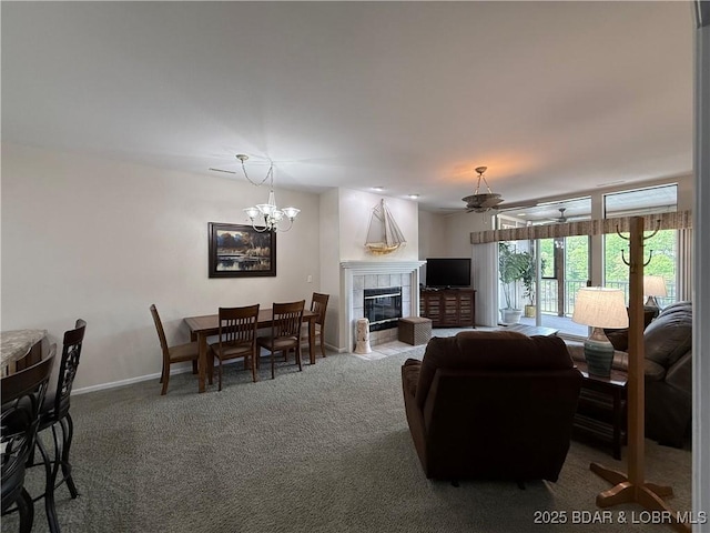 611 Lazy Days Rd Unit R-5, Osage Beach, MO 65065 - living room with baseboards, ceiling fan with notable chandelier, carpet, and a tile fireplace