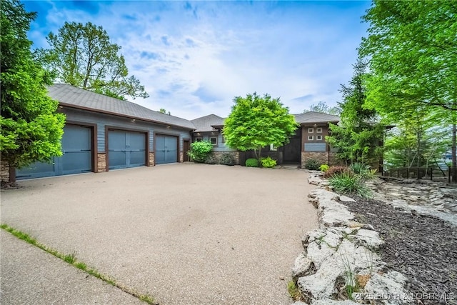 32 Wild Pines Ct, Sunrise Beach, MO 65079 - view of side of home featuring stone siding and a garage