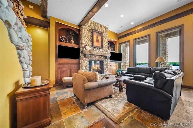 32 Wild Pines Ct, Sunrise Beach, MO 65079 - living area featuring stone tile flooring, a fireplace, beamed ceiling, recessed lighting, and built in features