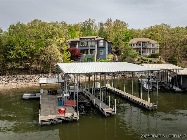 32 Wild Pines Ct, Sunrise Beach, MO 65079 - dock with boat lift and a water view