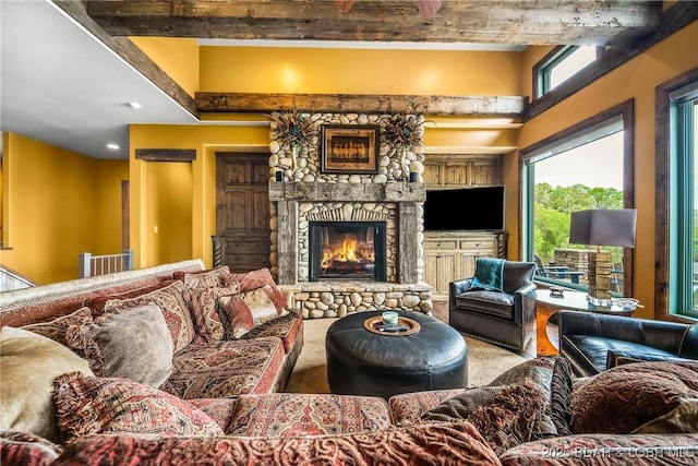 32 Wild Pines Ct, Sunrise Beach, MO 65079 - living area with plenty of natural light, a fireplace, beam ceiling, and recessed lighting