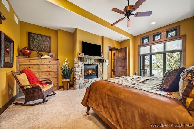 32 Wild Pines Ct, Sunrise Beach, MO 65079 - carpeted bedroom featuring a fireplace, access to exterior, baseboards, and recessed lighting