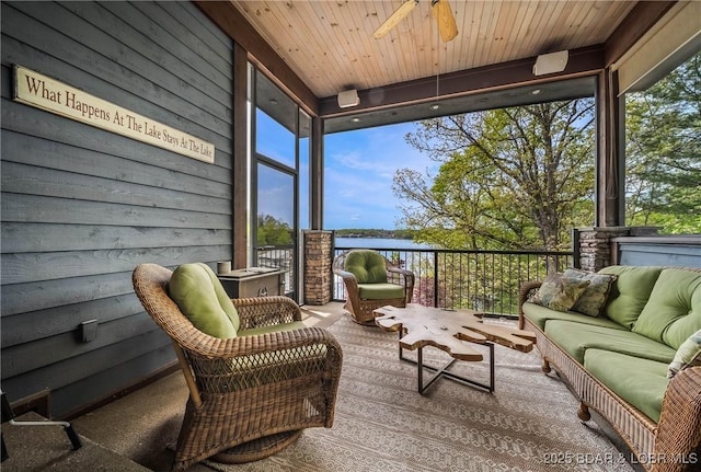 32 Wild Pines Ct, Sunrise Beach, MO 65079 - sunroom / solarium featuring floor to ceiling windows, an outdoor hangout area, ceiling fan, a water view, and carpet flooring