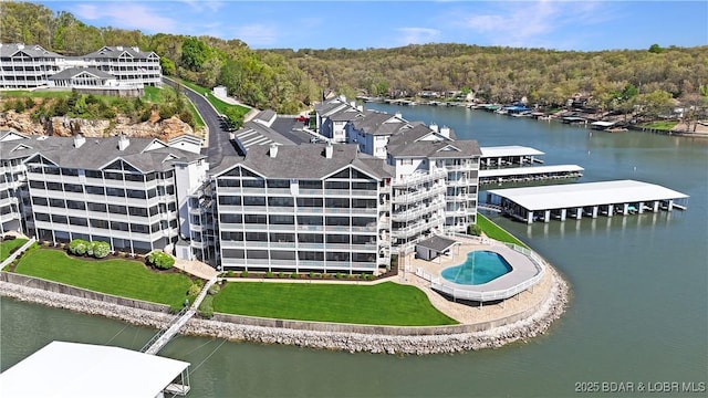 birds eye view of property featuring a water view