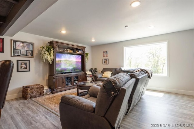 living room with baseboards, recessed lighting, and light wood-style floors