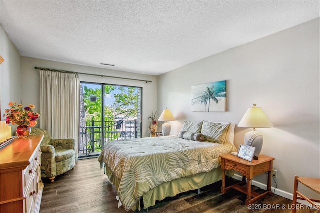 bedroom featuring visible vents, dark wood-style flooring, a textured ceiling, and access to exterior