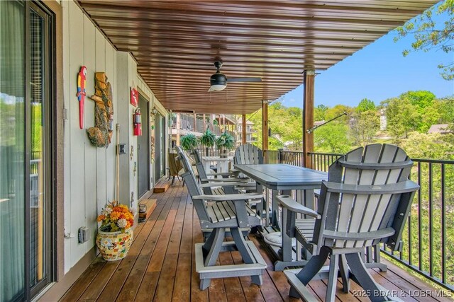 wooden terrace with outdoor dining area