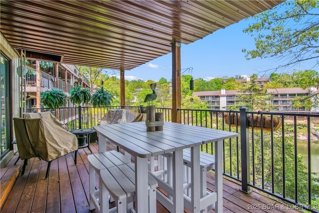 wooden deck with outdoor dining space