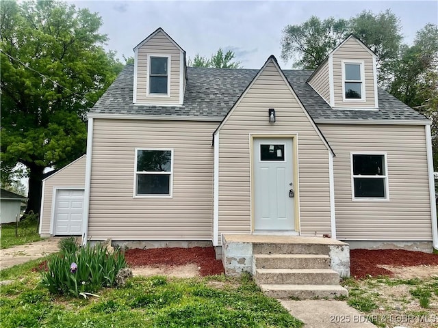 407 Cleveland St, Versailles, MO 65084 - cape cod-style house with a garage and a shingled roof