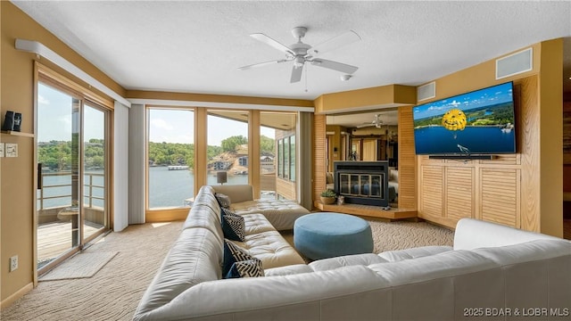 32 Cedar Ct Unit 3A, Lake Ozark, MO 65049 - living area with ceiling fan, light colored carpet, and plenty of natural light