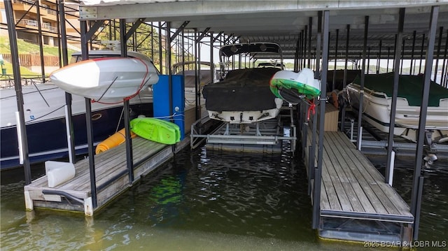 32 Cedar Ct Unit 3A, Lake Ozark, MO 65049 - view of dock featuring boat lift and a water view