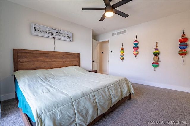 bedroom with carpet floors, baseboards, and visible vents