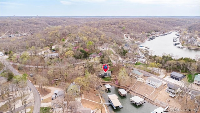 bird's eye view featuring a water view and a view of trees