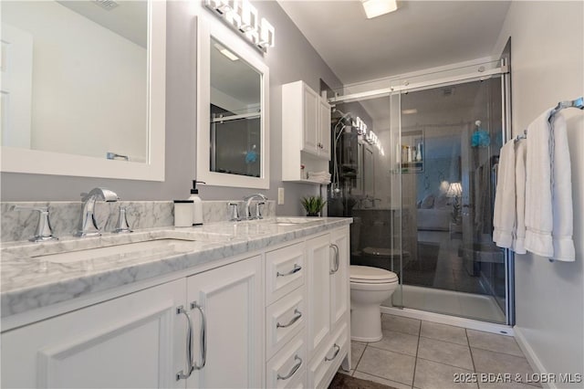 4800 Eagleview Dr Unit 114A, Osage Beach, MO 65065 - full bath featuring tile patterned flooring, a sink, a stall shower, and double vanity