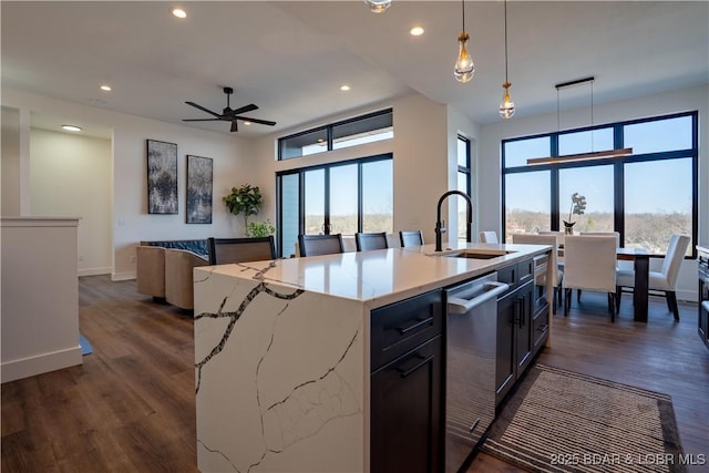 kitchen featuring recessed lighting, a sink, dark wood-style flooring, and dishwasher