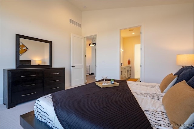 bedroom featuring baseboards, light colored carpet, high vaulted ceiling, and visible vents