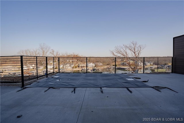 view of patio / terrace featuring fence