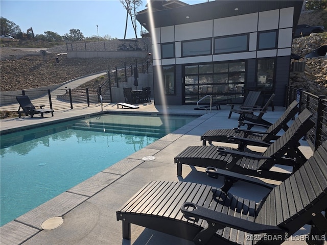 pool with a patio