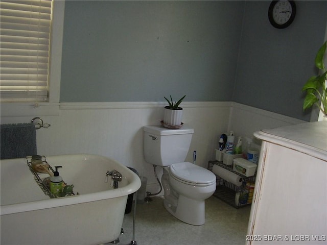 3521 S 240th Rd, Mo, MO 65685 - bathroom featuring wainscoting, a freestanding bath, and toilet