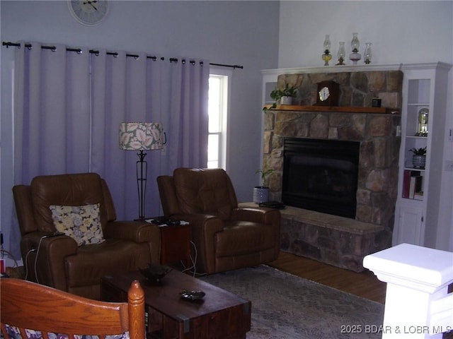 3521 S 240th Rd, Mo, MO 65685 - living area with a stone fireplace and wood finished floors