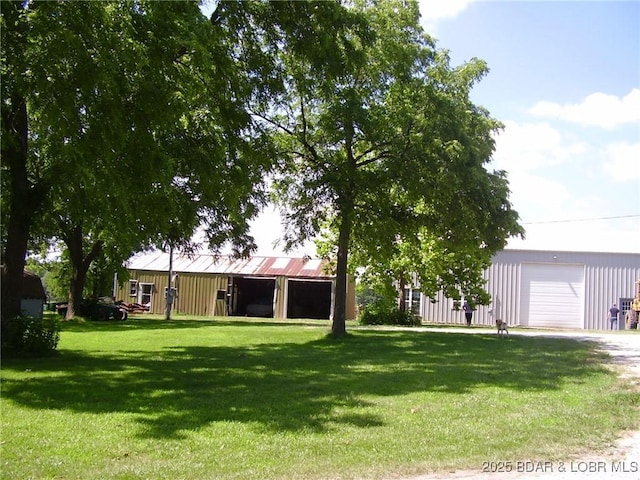 3521 S 240th Rd, Mo, MO 65685 - view of yard featuring an outbuilding, an outdoor structure, and driveway