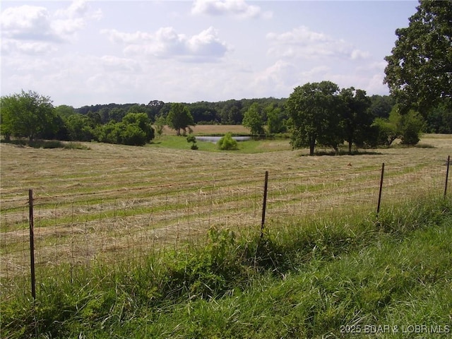 3521 S 240th Rd, Mo, MO 65685 - view of yard with a water view, a rural view, and fence