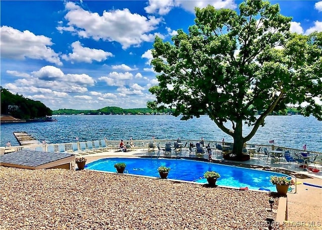 405 Barba Le Ln Unit 3B, Lake Ozark, MO 65049 - community pool featuring fence, a patio, and a water view