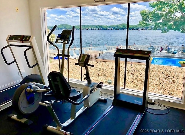 405 Barba Le Ln Unit 3B, Lake Ozark, MO 65049 - workout room with a healthy amount of sunlight and a water view