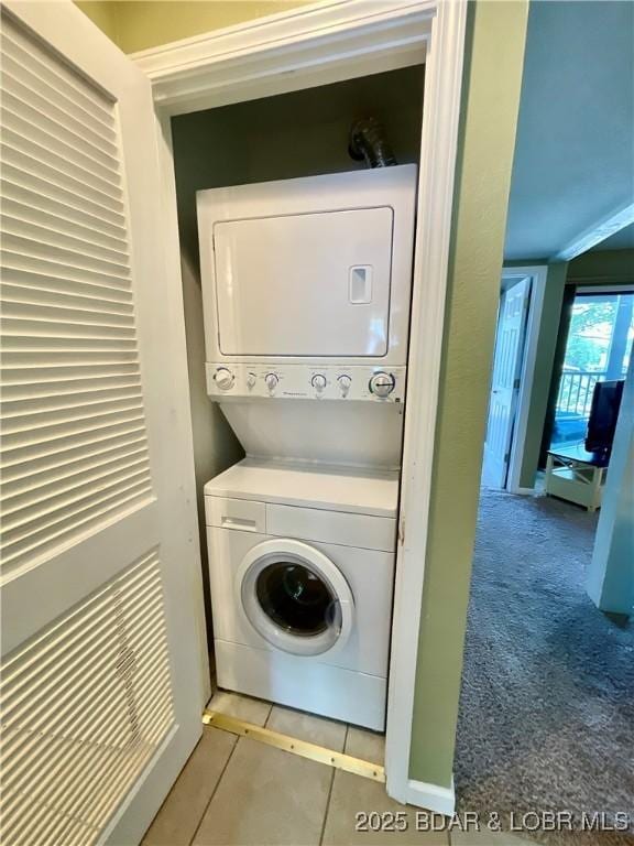 405 Barba Le Ln Unit 3B, Lake Ozark, MO 65049 - washroom featuring laundry area and stacked washer and clothes dryer