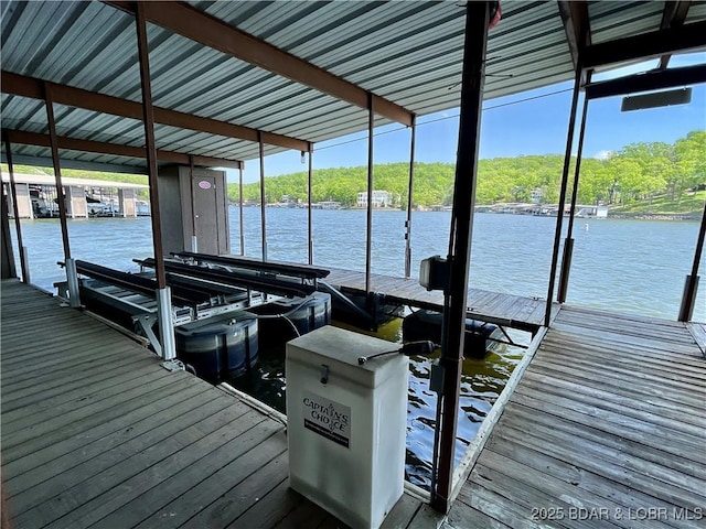 405 Barba Le Ln Unit 3B, Lake Ozark, MO 65049 - view of dock with boat lift and a water view