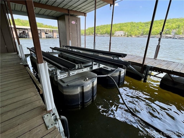 405 Barba Le Ln Unit 3B, Lake Ozark, MO 65049 - dock area featuring boat lift and a water view