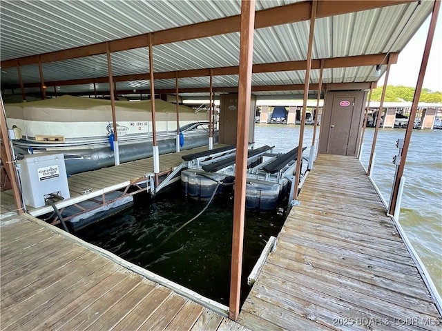 405 Barba Le Ln Unit 3B, Lake Ozark, MO 65049 - dock area featuring a water view and boat lift